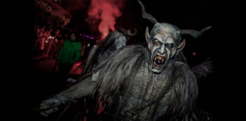A white Krampus roars in a haunted Long Island themed park.